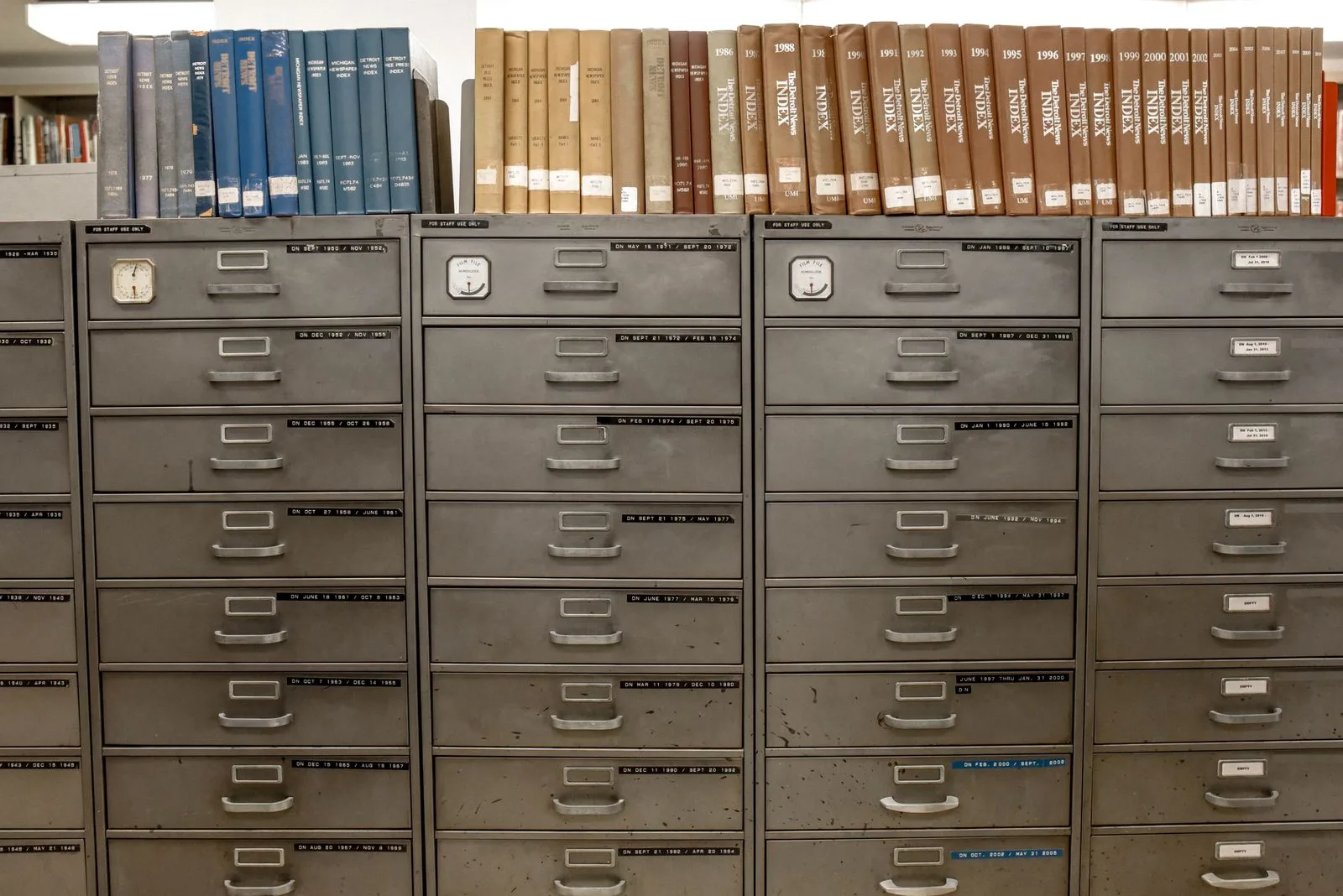 Rows of commercial metal filing cabinets holding business records